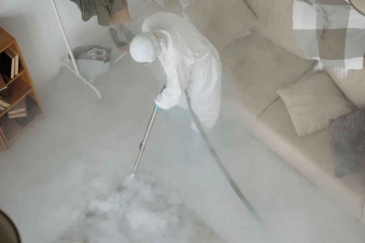 Biohazard cleanup technician in protective equipment, Hopelawn, NJ